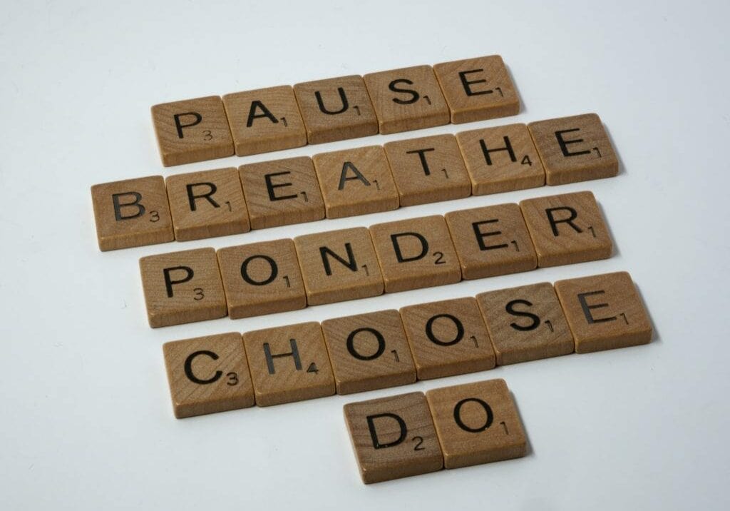 Scrabble letters describing how to deal with overwhelm